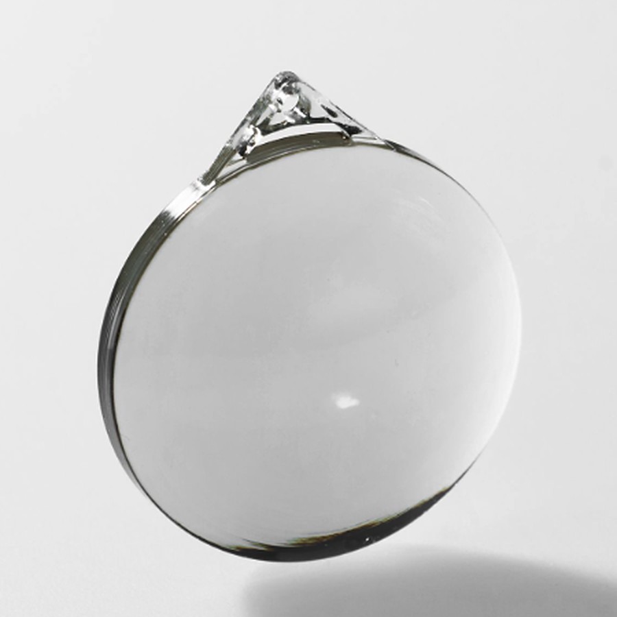 Clear printed lens with a small handling tab, photographed on a white background